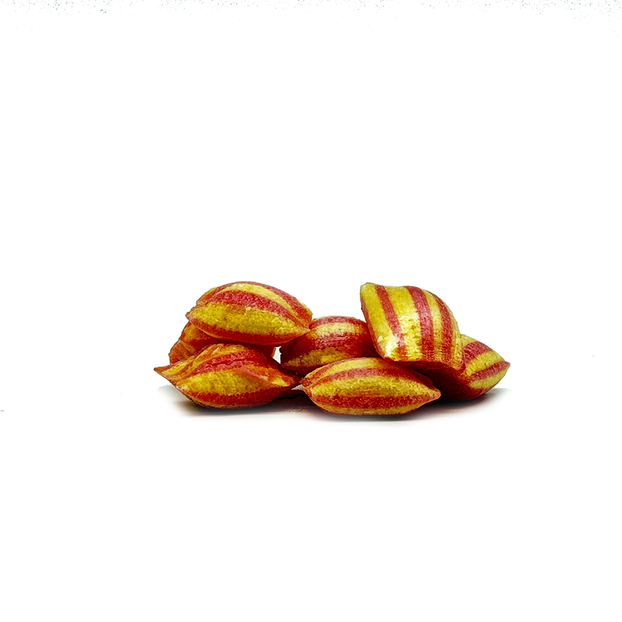 pieces of Sticky's strawberry and piña colada flavored Lava Fizz candy