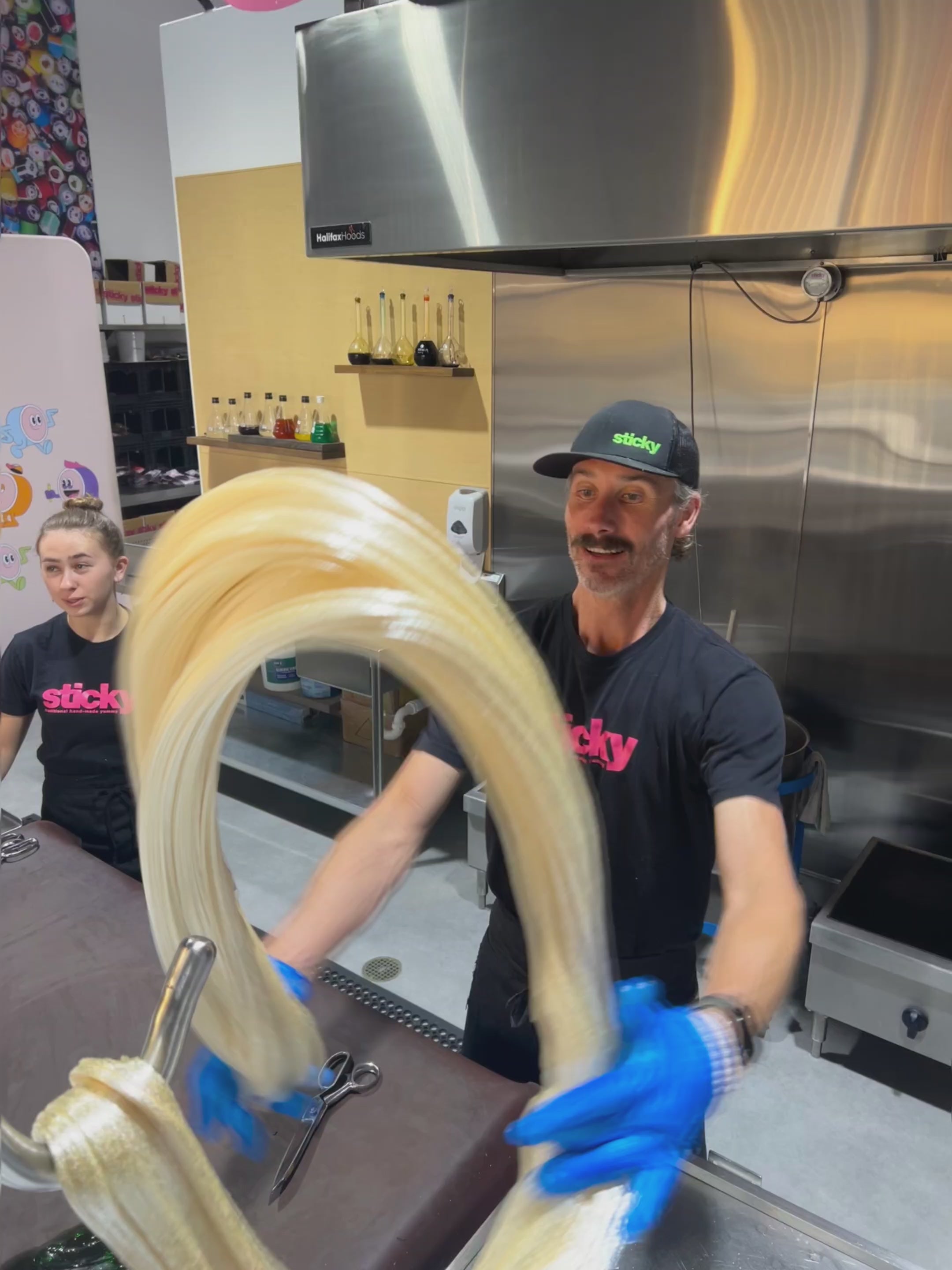 Load video: traditional candy artisans making Sticky&#39;s Sour Cherry candy