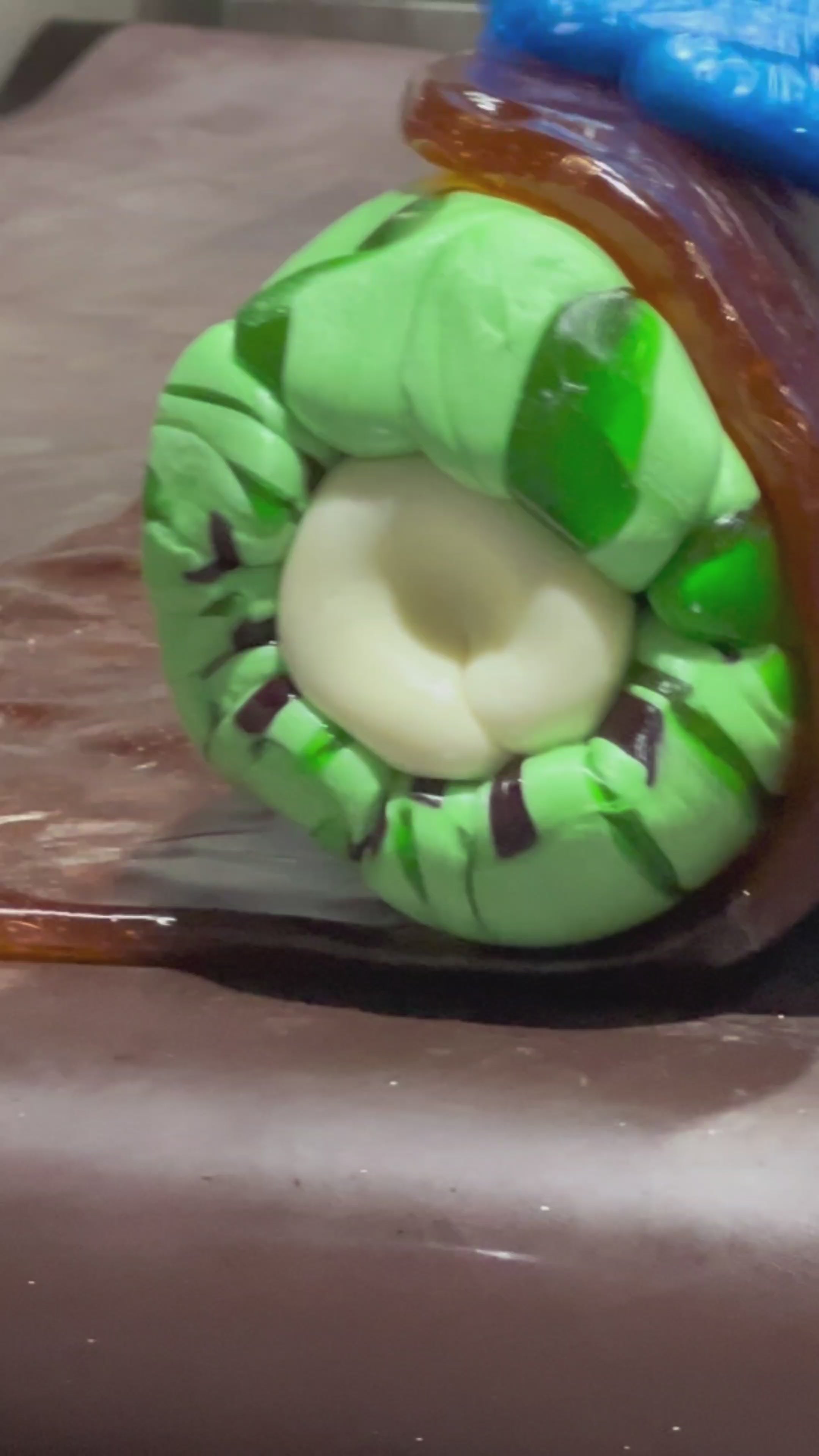 Load video: traditional candy artisans making Sticky&#39;s Kiwi Fruit candy