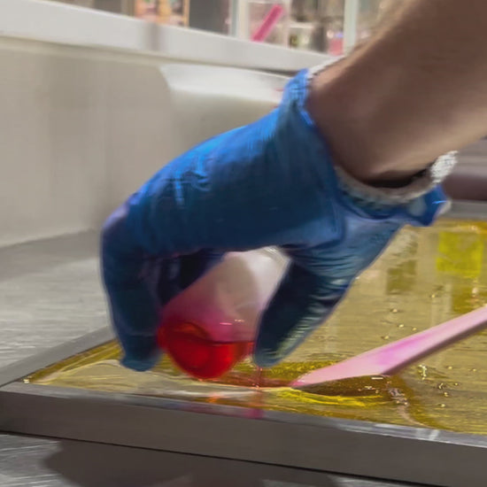 Sticky's artisans crafting their Acid Drop Strawberry candy