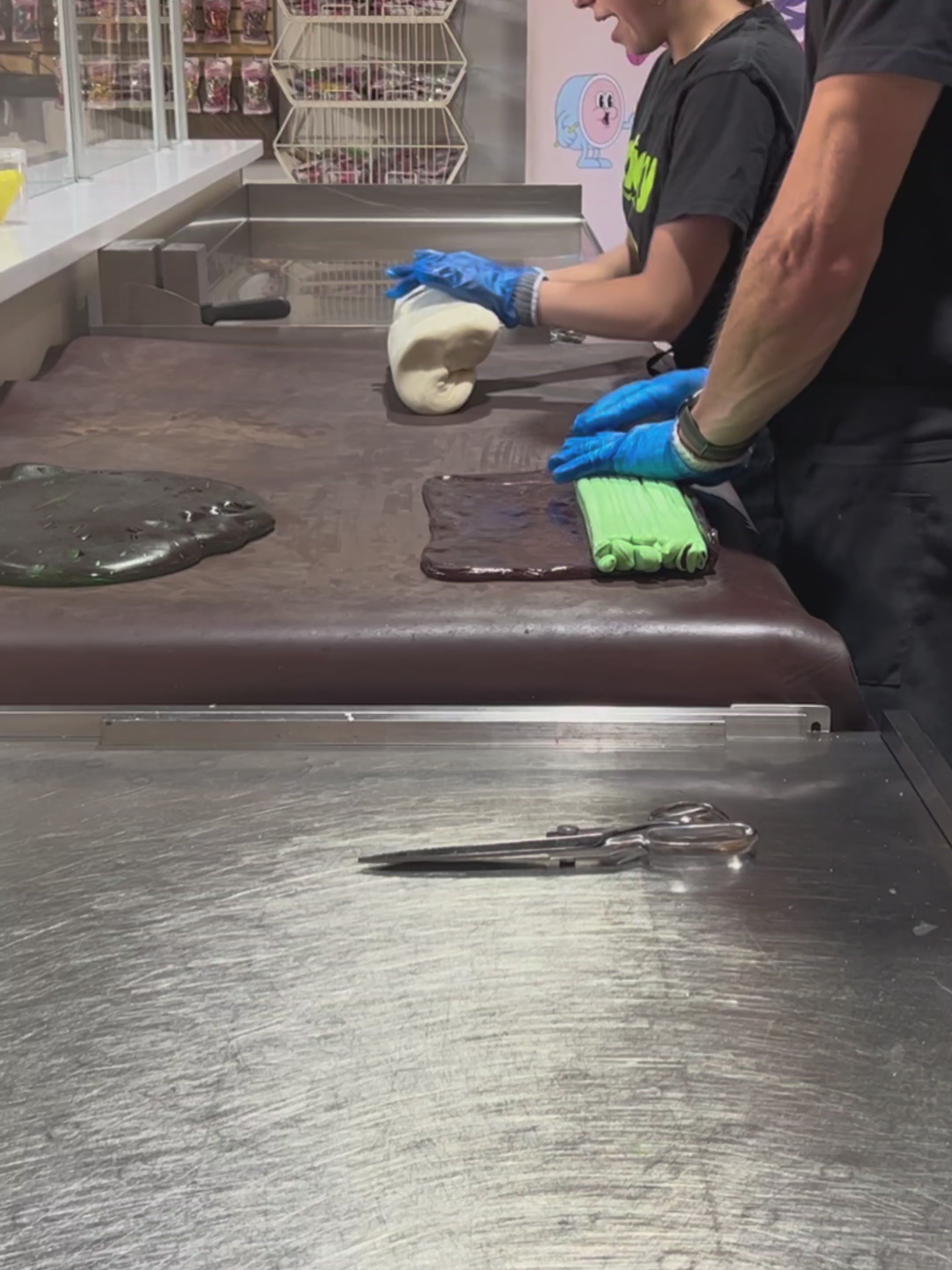 Load video: traditional candy artisans making Sticky&#39;s Pickle candy