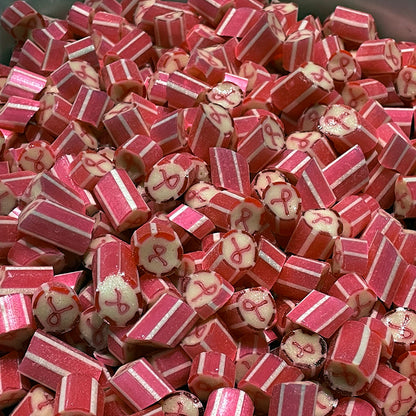 pieces of Sticky's raspberry lemonade flavored Cause Ribbon Candy